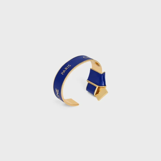 Celine Ribbon Knotted Cuff in Enamel and Brass with Gold Finish
