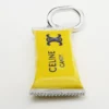 Charms Candy Bar in Enamel and Brass with Rhodium Finish