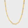 Charms Long Necklace in Brass with Gold and Rhodium Finsih
