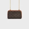 Clutch on Chain in Triomphe Canvas and Lambskin Clutch on Chain in Triomphe Canvas and Lambskin