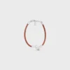 Knot Bracelet in Calfskin and Brass with Rhodium Finish Knot Bracelet in Calfskin and Brass with Rhodium Finish