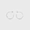 Triomphe Asymmetric Hoops in Brass with Rhodium Finish